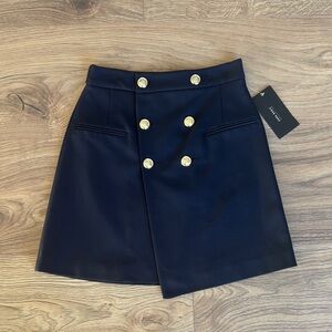 Navy blue skirt with gold buttons